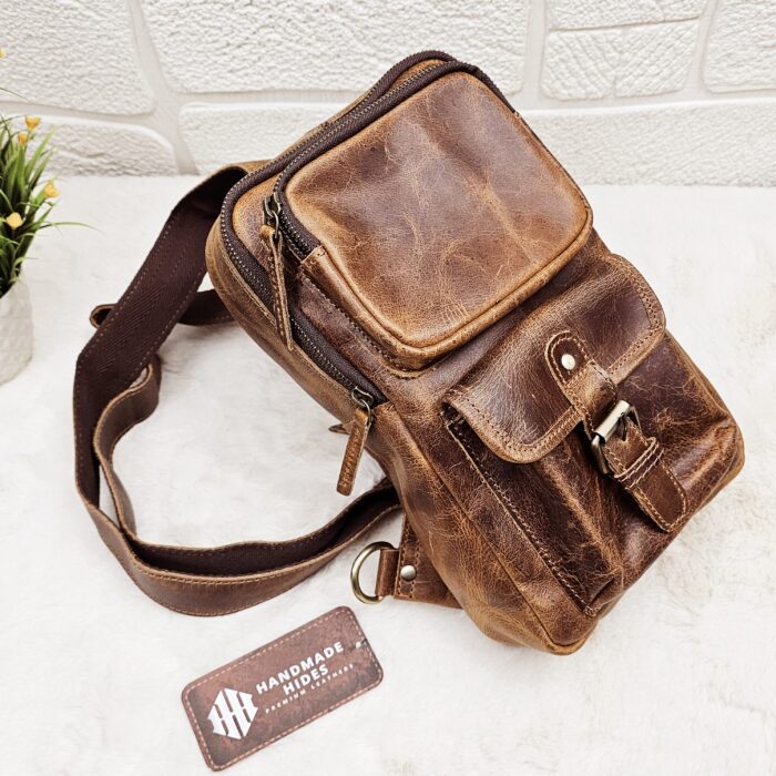 Handmade leather crossbody bag with vintage design and multiple pockets