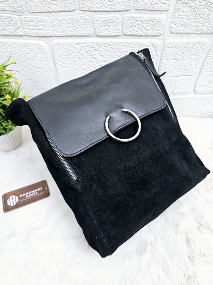 Handmade black suede leather backpack with soft, velvety texture