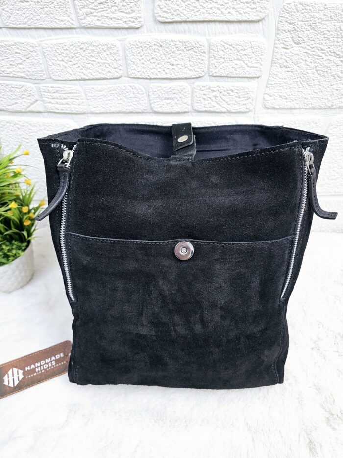 Handmade black suede leather backpack with soft, velvety texture
