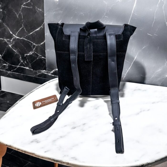 Handmade black suede leather backpack with soft, velvety texture