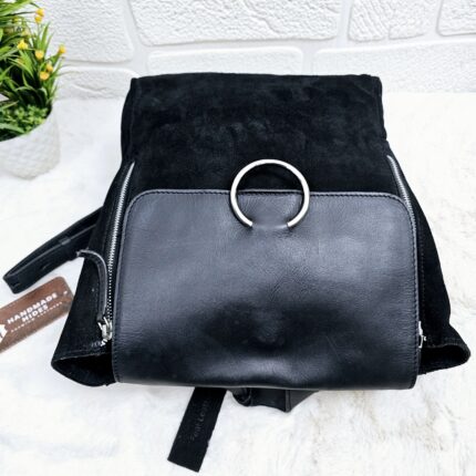 Handmade black suede leather backpack with soft, velvety texture