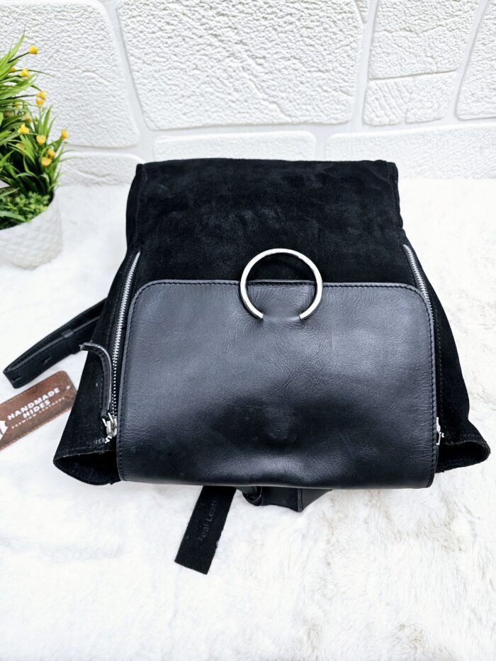 Handmade black suede leather backpack with soft, velvety texture