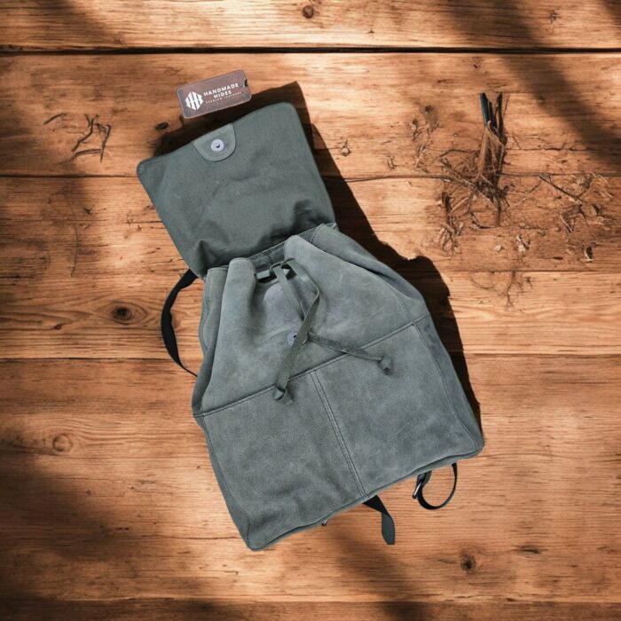 Premium handmade grey leather backpack with spacious compartments, adjustable strap, and multiple pockets. Perfect for work, travel, or daily use.
