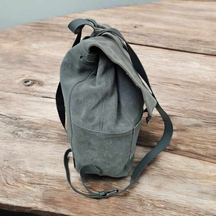 Premium handmade grey leather backpack with spacious compartments, adjustable strap, and multiple pockets. Perfect for work, travel, or daily use.