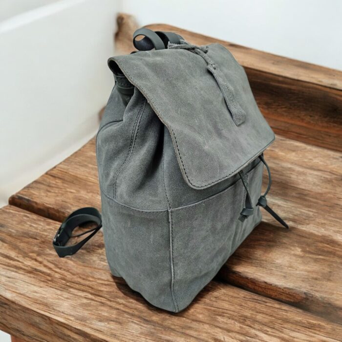 Premium handmade grey leather backpack with spacious compartments, adjustable strap, and multiple pockets. Perfect for work, travel, or daily use.