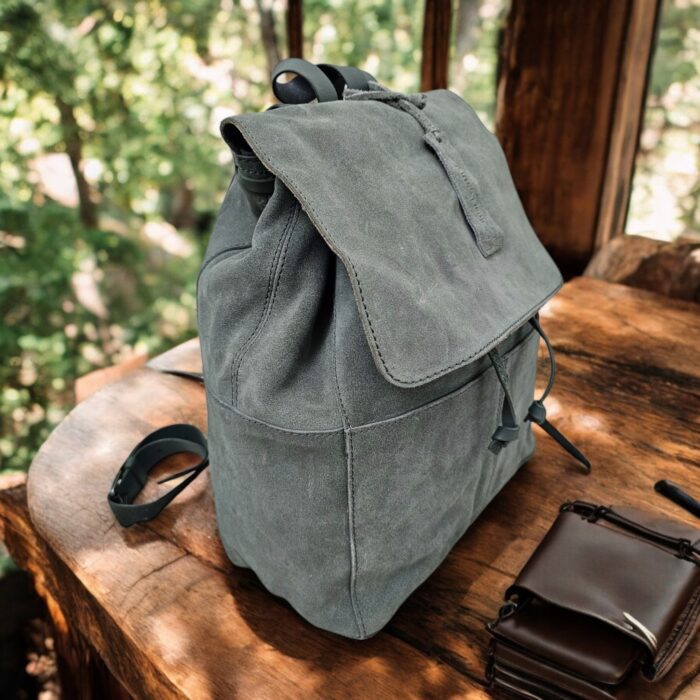 Premium handmade grey leather backpack with spacious compartments, adjustable strap, and multiple pockets. Perfect for work, travel, or daily use.