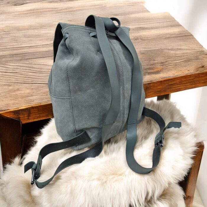 Premium handmade grey leather backpack with spacious compartments, adjustable strap, and multiple pockets. Perfect for work, travel, or daily use.