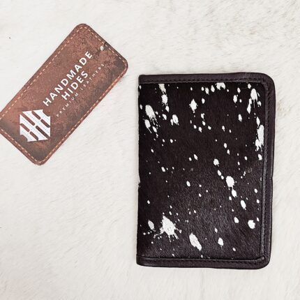 Hair-on-hide leather passport holder open with cards