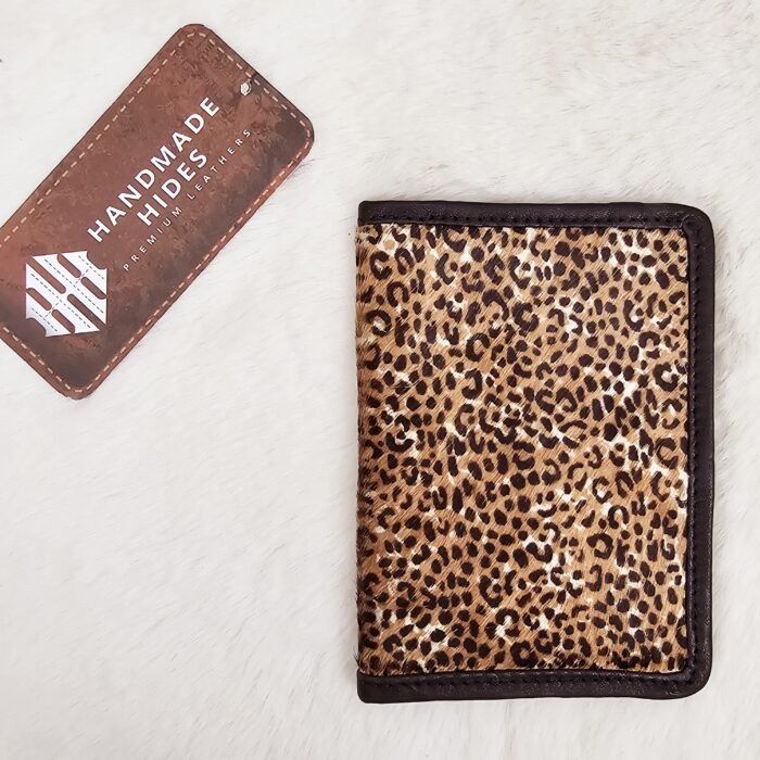 Hair-on-hide leather passport holder open with cards