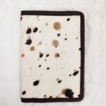 Hair-on-hide leather passport holder open with cards