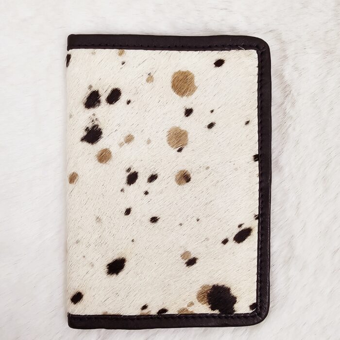 Hair-on-hide leather passport holder open with cards