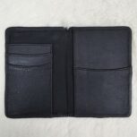 Hair-on-hide leather passport holder open with cards