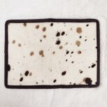 Hair-on-hide leather passport holder open with cards