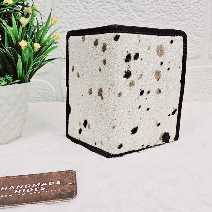 Hair-on-hide leather passport holder open with cards
