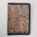 Hair-on-hide leather passport holder open with cards