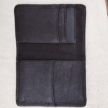 Hair-on-hide leather passport holder open with cards