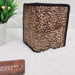Hair-on-hide leather passport holder open with cards