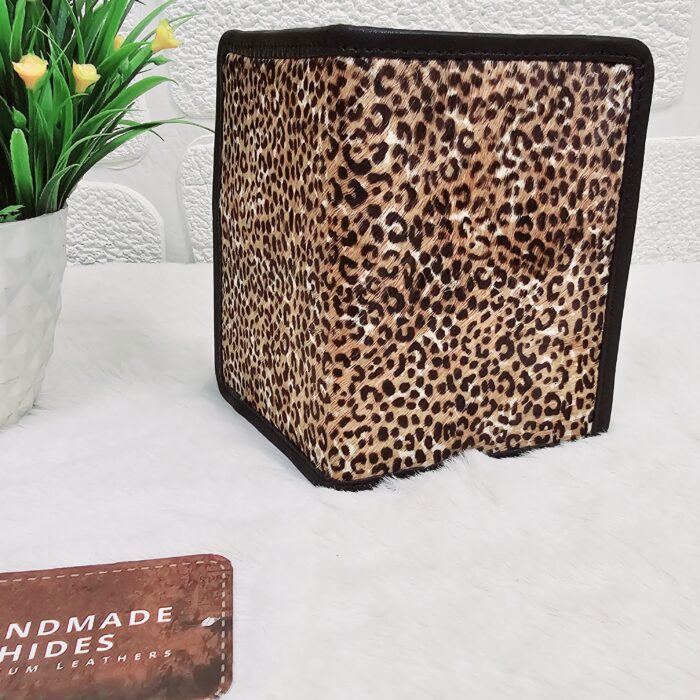 Hair-on-hide leather passport holder open with cards