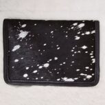 Hair-on-hide leather passport holder open with cards