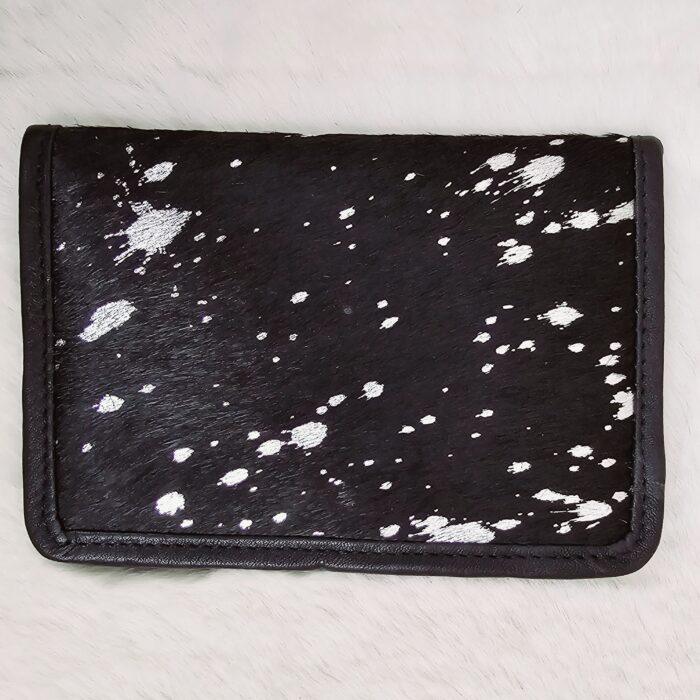 Hair-on-hide leather passport holder open with cards