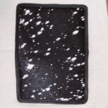 Hair-on-hide leather passport holder open with cards