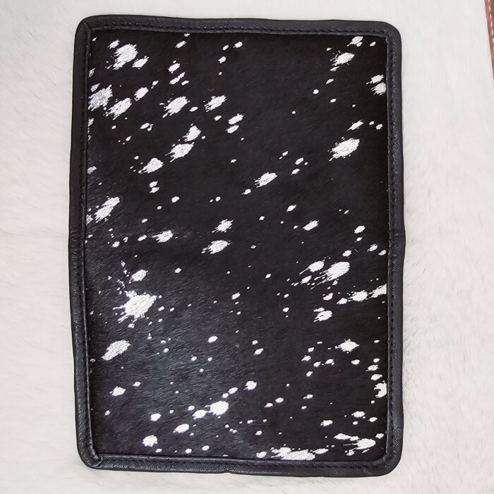 Hair-on-hide leather passport holder open with cards