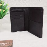 Hair-on-hide leather passport holder open with cards
