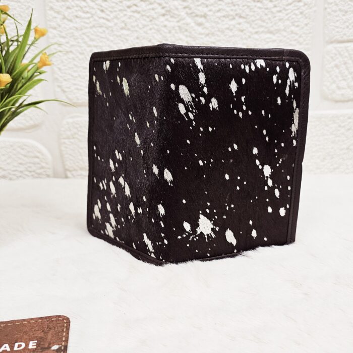 Hair-on-hide leather passport holder open with cards