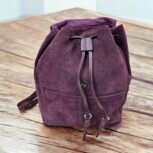 Handcrafted genuine leather backpacks in purple, grey, and brown – premium travel and work bags
