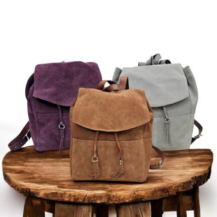 Handcrafted genuine leather backpacks in purple, grey, and brown – premium travel and work bags