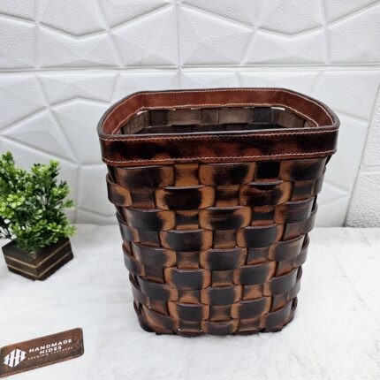 Handwoven leather wastebasket in dark brown
